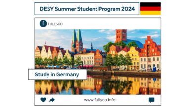 Colorful historic buildings and church towers reflect in a river under a blue sky, promoting the DESY Summer Student Program 2024 in Germany. Visit www.fullsco.info for details.